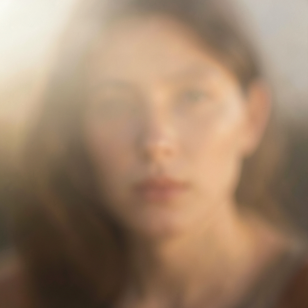 A warm, soft-focus portrait in natural light with earthy tones, conveying quiet introspection and gentle hope.
